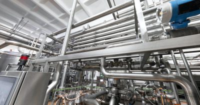 Industrial zone background concept. Steel pipelines and cables in blue tones